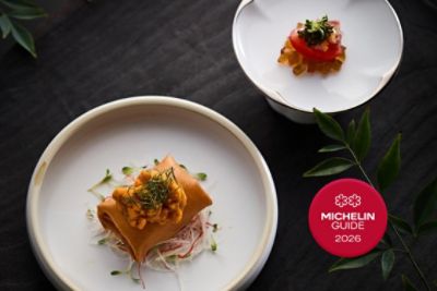 A dish from The Langham Xintiandi Tang Court with the 2 star Michelin Logo